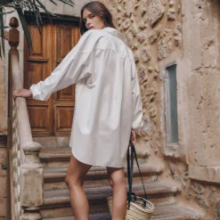 The White Cotton Shirt Dress 5 The White Cotton Shirt Dress -Mikuta Store mikuta the white cotton shirt dress the small cesta bag the black leather buckle sandals myriam t SS25 04 2 scaled