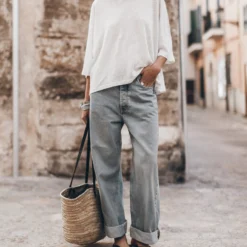 The White Loose Linen T-Shirt -Mikuta Store mikuta the white loose linen t shirt the blue baggy jeans the black studded leather sandals the large cesta bag 5017 scaled